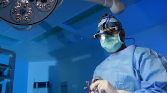 Dr. Patel performing a spine surgery.