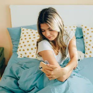 A Woman Checks Her Blood Sugar Levels After Waking Up.
