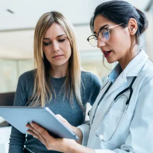A Provider Goes Over a Patient's Chart with Her.