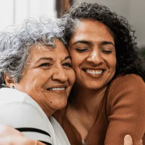 A Daughter Hugs Her Senior Mom at Home