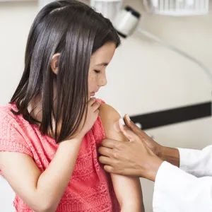 Little girl getting a shot