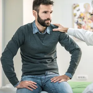 Man at doctor's office for pelvic floor issues