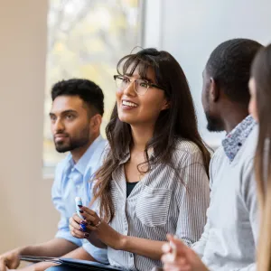 A Group of Young Professionals Having a Group Discussion in a Class.