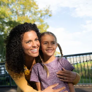 A Mother and Daughter Enjoy the Park on a Sunny Day