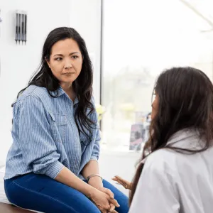 A woman talks to her doctor.
