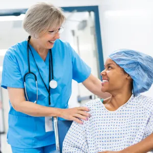 Nurse with young female patient at the hospital.