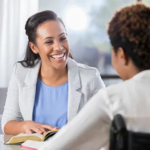 A CPE Pastor Reads the Bible to a Patient