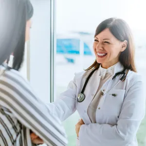 female physician talking to female patient