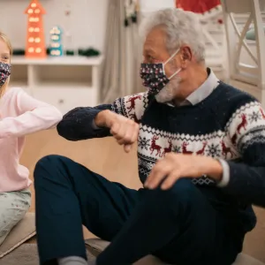 Grandpa giving presents to granddaughter