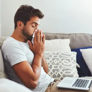 A man blows his nose