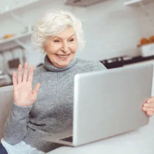 A senior woman video calling.