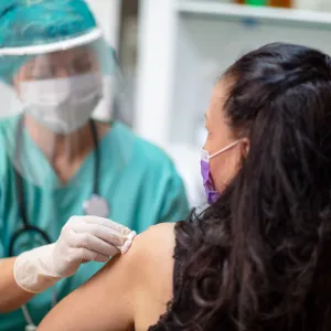 A woman getting her annual flu shot.