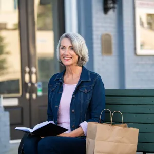 a woman sitting on a bench