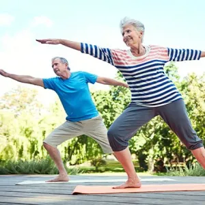 Senior Couple Doing Yoga Outside