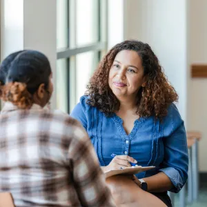 Two women having a conversation about mental health.
