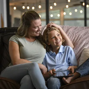 Mother and child sitting on a couch