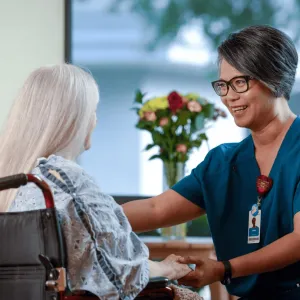 An older woman with her home care provider.