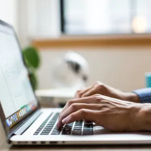 A man working on a laptop.