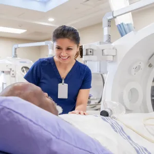 A nurse comforting a patient with her presence