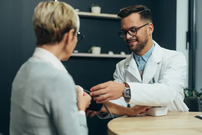 A Provider Check's a Patient's Blood Pressure