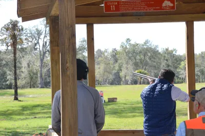 man shooting a gun