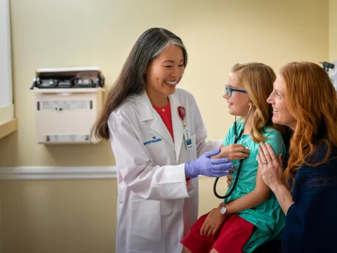 Centra Care Provider Shows a Young Patient How to Listen to Her Heart Beat