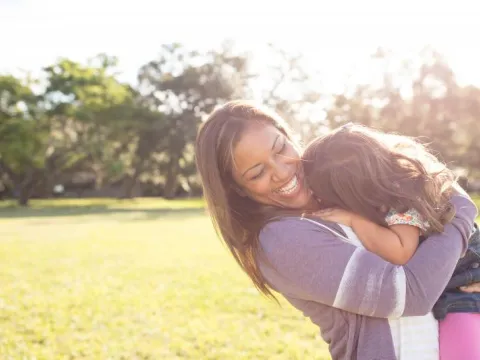 Woman Holding Daughter