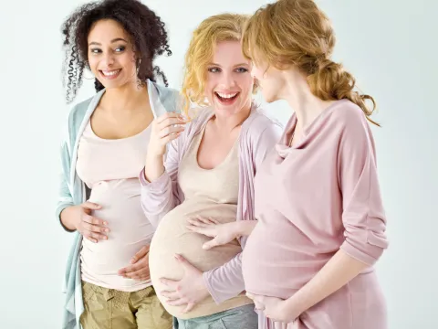 Three women chatting after a Dancing for Birth class.
