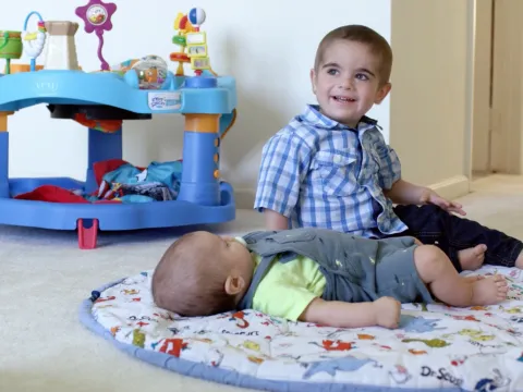 Grant and his younger brother, Wyatt, play on the floor.