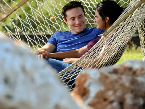 A relaxing afternoon with her husband in their hammock.