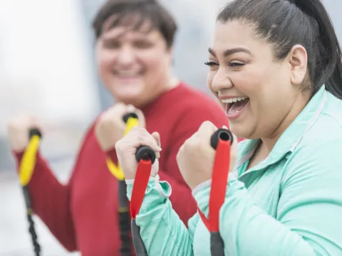 Women Exercising with Bands