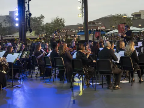 AdventHealth Orchestra Performing on the AdventHealth Waterside Stage at Disney Springs.
