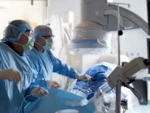 Two surgeons performing a mock surgery