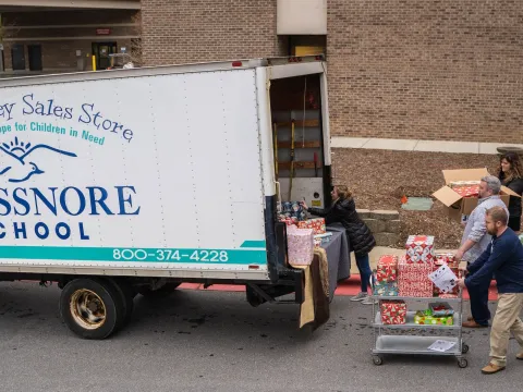 People loading a truck with donations