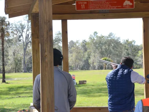 man shooting a gun