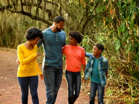 A family goes for a nature walk