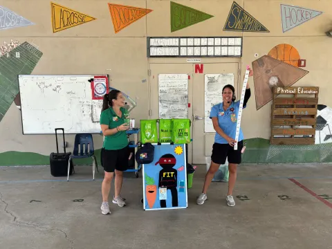Two women perform a demonstration for the Mission Fit program.