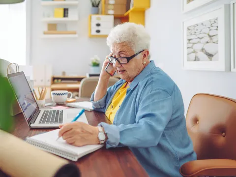 Elderly Woman working from home