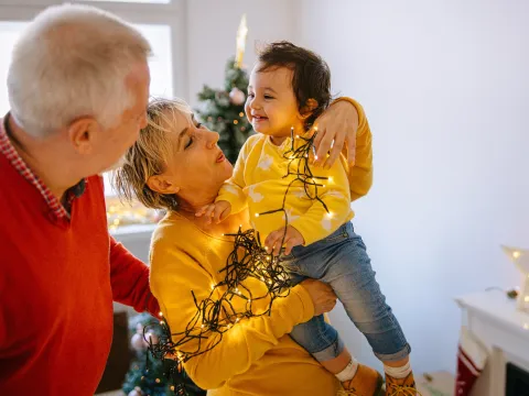 Trimming the tree with the family.