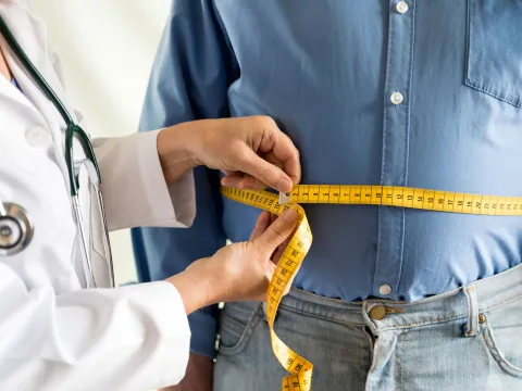 A man visits his doctor for a check up after bariatric surgery.