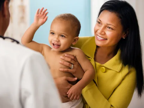 A mom brings her child to the doctor for a check up.