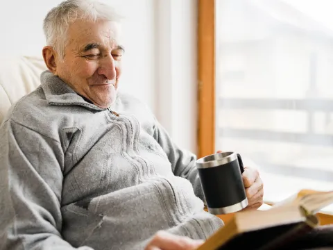 An older man reading. 