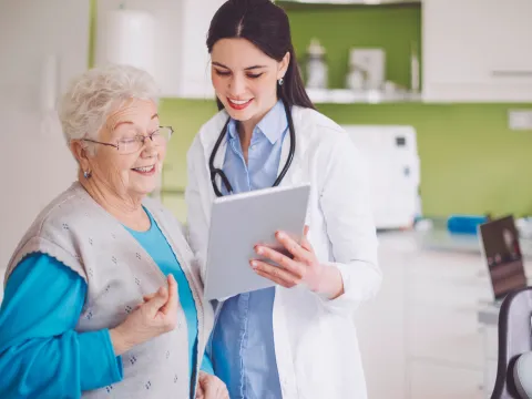 A woman reviews her test results with her doctor.