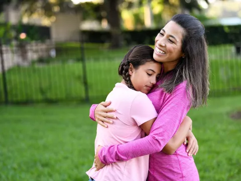 Woman holding her daughter