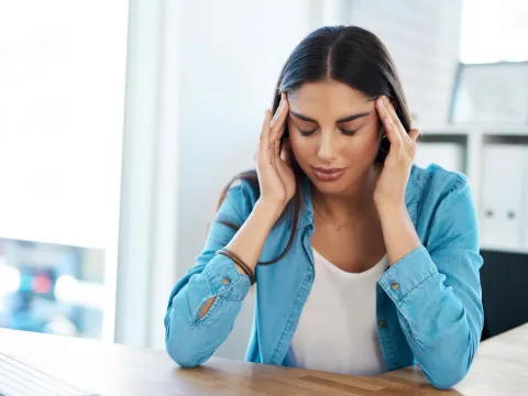 Woman having a migraine