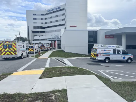 AdventHealth North Pinellas hospital with ambulances