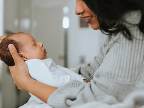 Mom holding infant