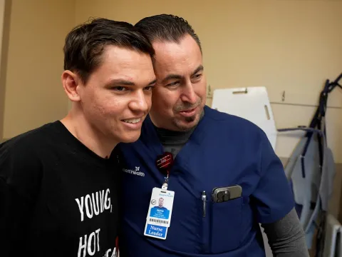 Josiah Stubbs visits Jayme Cluka, AdventHealth Daytona Beach ICU nurse manager.