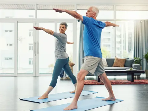 couple-doing-yoga-indoors