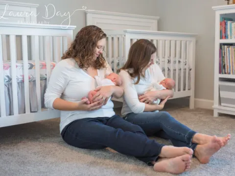 Meagan C and her wife holding her babies